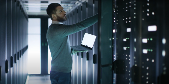 man stood at a server rack. Looking for a SAP contractor, perhaps?